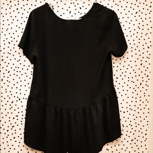 Black peplum top. Pleione